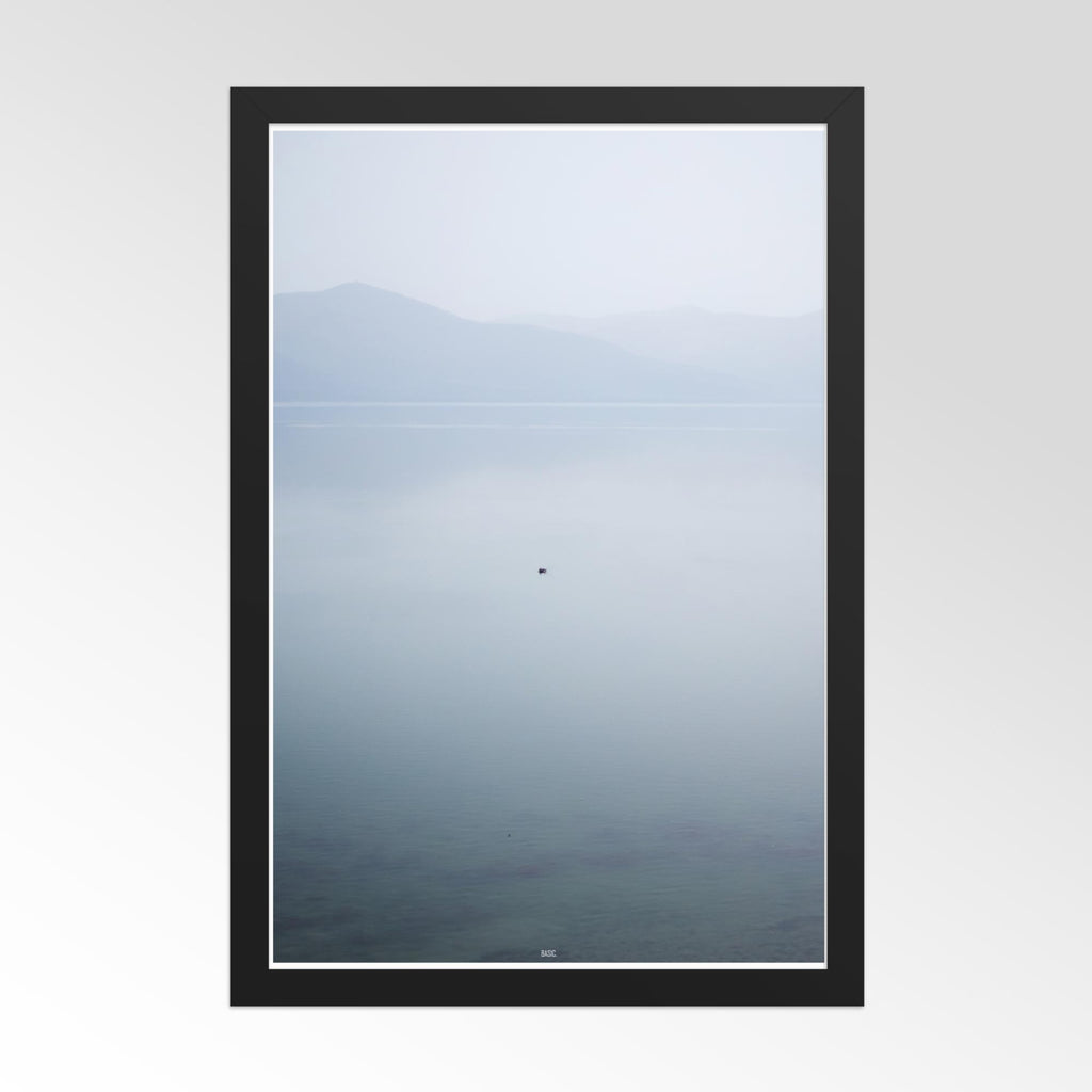 Framed artwork of a mountain landscape with a black border on a white background