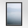 Framed artwork of a mountain landscape with a black border on a white background