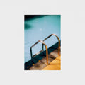 Metal ladder in a pool with a white background